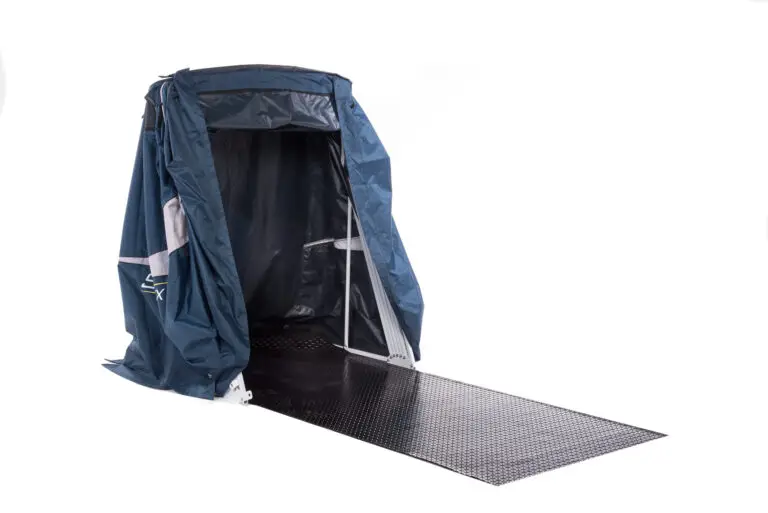 Open Speedway motorcycle storage shelter showing the steel frame and rubber floor