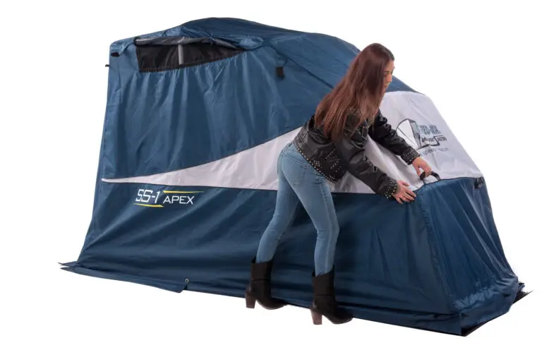 Woman closing the clamshell cover of a Touring Speedway Shelter
