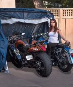 deluxe speedway shelter open with two motorcycles inside and motorcycle rider