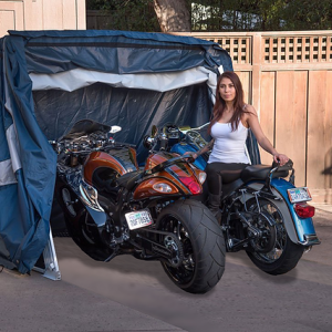 deluxe speedway shelter open with two motorcycles inside and motorcycle rider