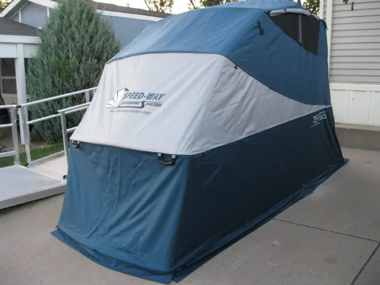 Closed Speedway motorcycle shelter on a residential driveway