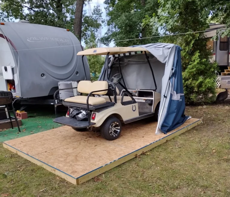 Golf cart stored in a Deluxe Speedway Shelter on a wooden deck