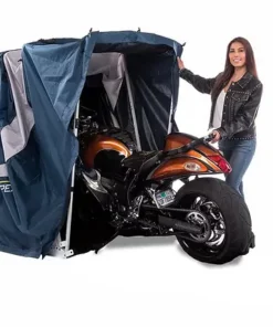 biker easily putting away her sport motorcycle in the sport speedway shelter