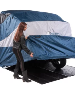 female biker demonstrating how easy to open and close deluxe speedway motorcycle shelter