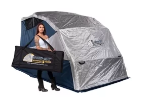deluxe shelter combo kit set up with the double duty uv cover and a woman with the durable carrying case on her shoulder