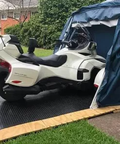 can am spyder in deluxe speedway shelter with durable rubber flooring