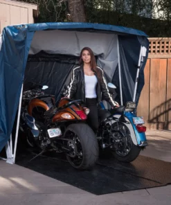 two motorcycles inside deluxe speedway shelter