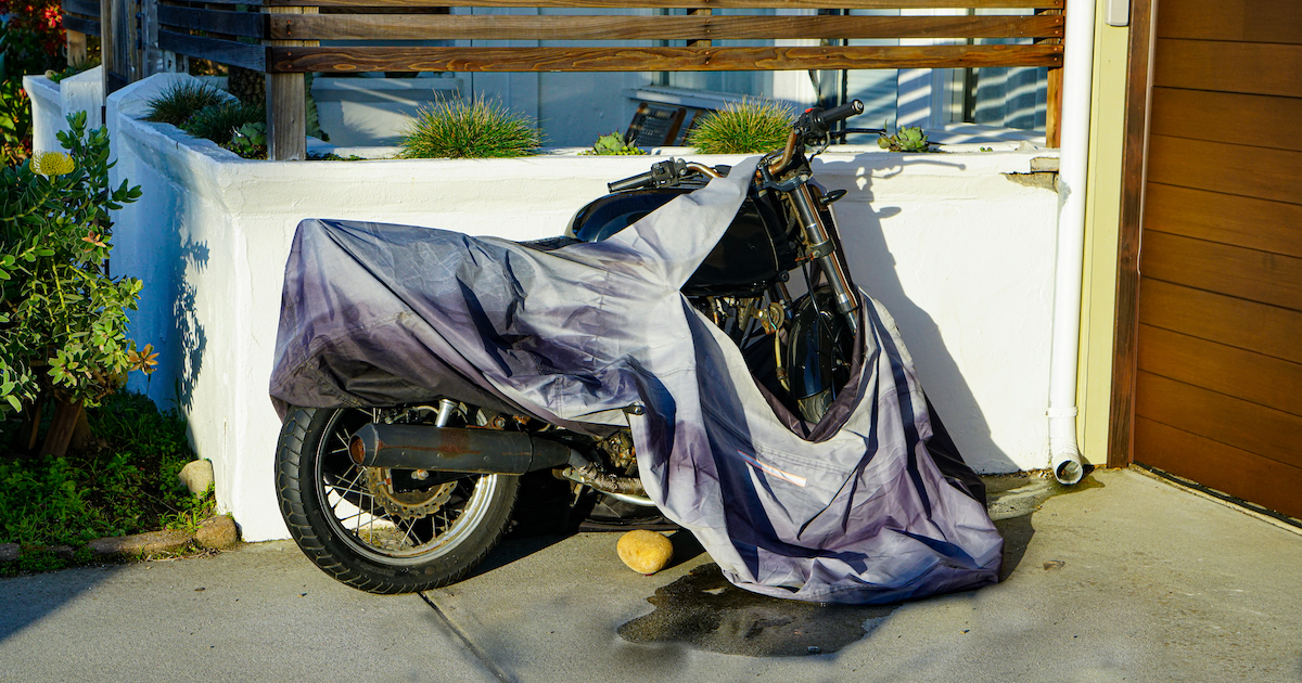 cheap motorcycle cover destroyed exposing bmw motorcycle to rain and the elements