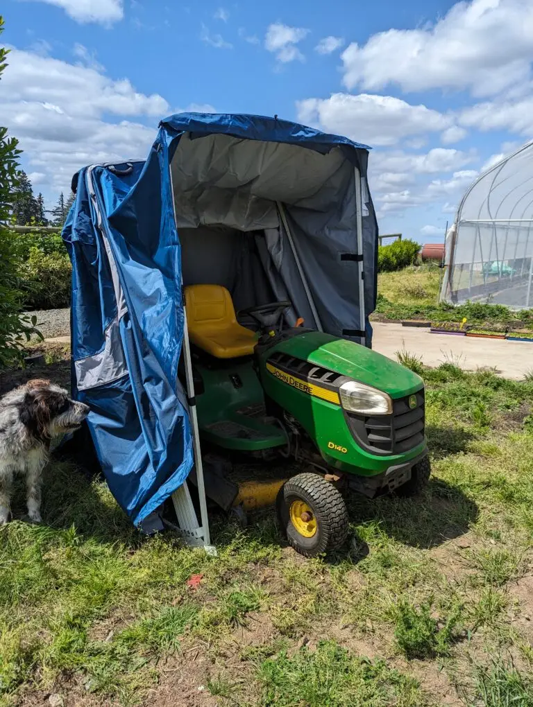 John Deere riding lawn mower stored in a Speedway Shelter