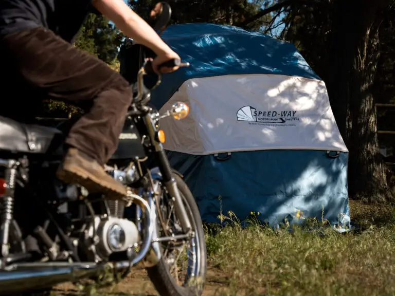Rider on a motorcycle beside a closed Speedway Shelter