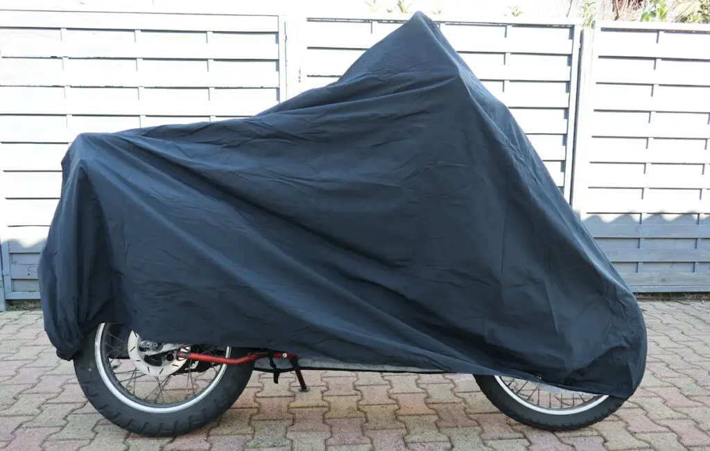 motorcycle stored under motorcycle cover