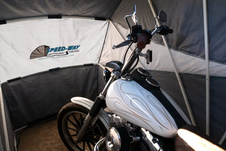 Chopper motorcycle parked inside a Speedway motorcycle storage shelter
