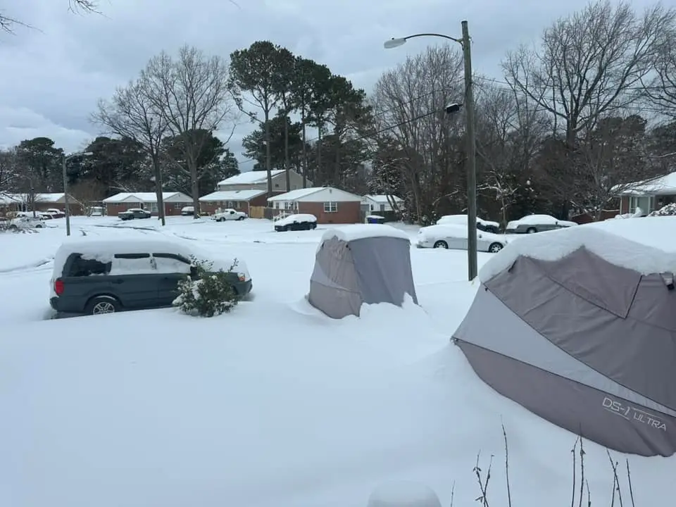 Snow-covered Speedway Shelters in a residential neighborhood in winter
